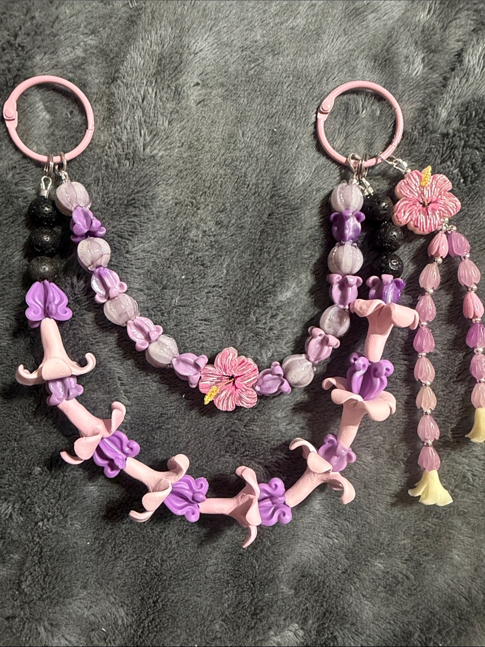 Purple double strand Puakenikeni, crown flower, orchid and Pikake purse lei